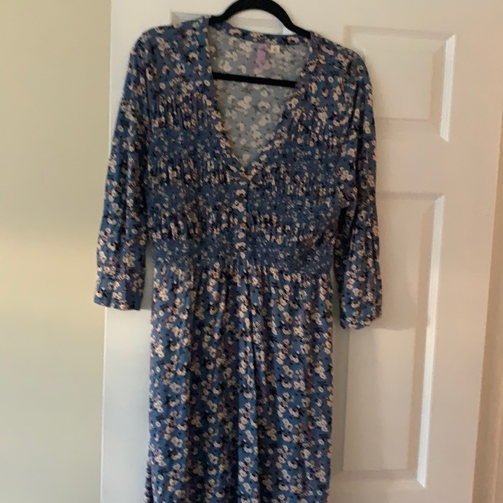 Blue flower dress with quarter sleeves. Hits above the knees